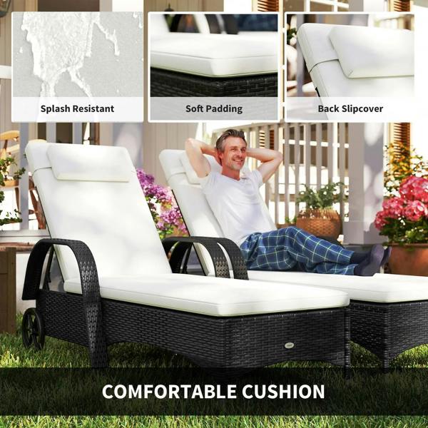 Black rattan sun lounger with white padded cushions and soft back slipcover