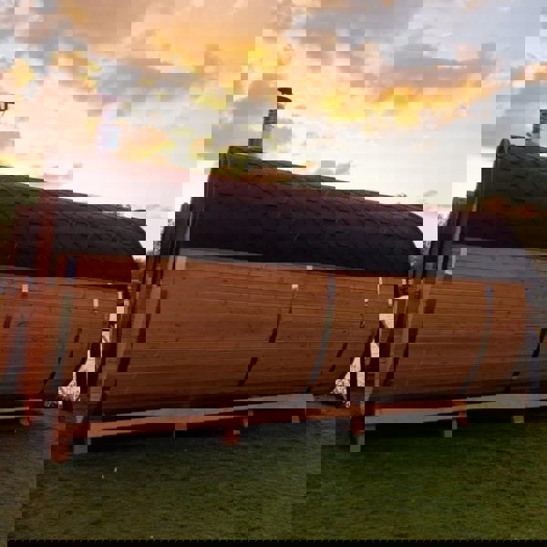 Barrel sauna with sunset view