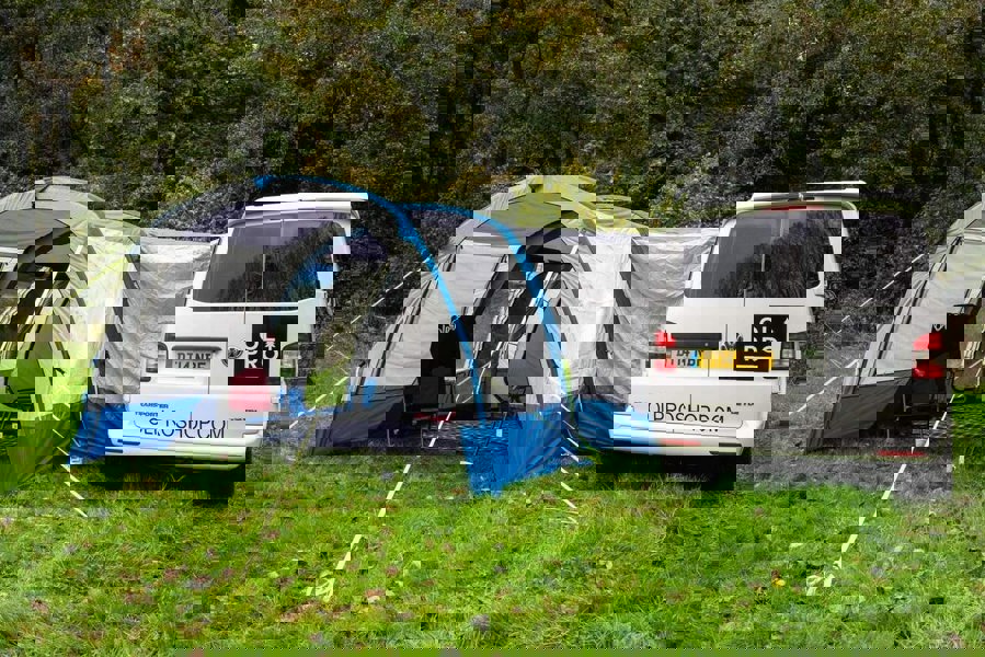 An image of the OLPRO Blue Cocoon Breeze Campervan Awning Extension attached to the Cocoon Breeze that has been fixed to a VW Campervan.