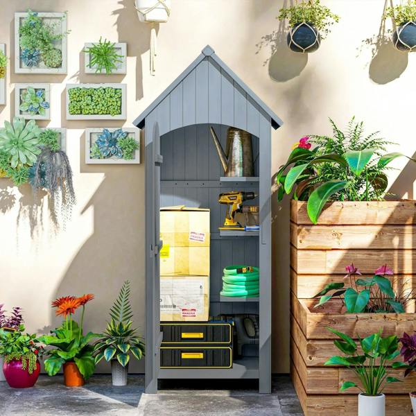 Grey wooden outdoor storage shed with open lockable door, shelves holding garden tools