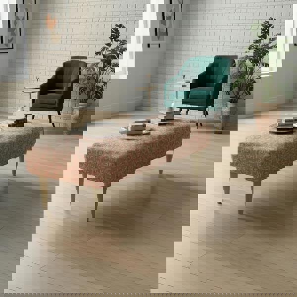 Elegant low-profile ottoman with seamless surface and artistic fabric pattern, handcrafted in the UK