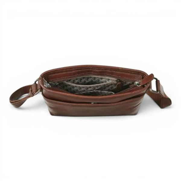 Premium cognac leather shoulder bag with vegetable tanned finish for
everyday use.