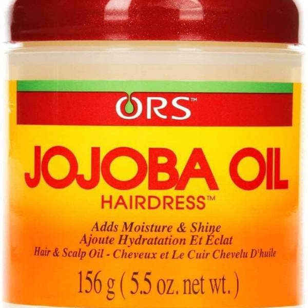 Jar of ORS Jojoba Oil Hairdress with red lid and orange label.