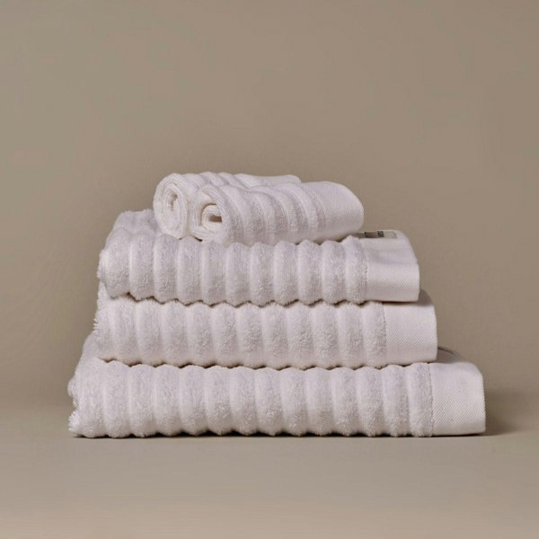 Organic cotton white bathroom towels. Super soft ribbed towels in four sizes: hand towel, bath towel, bath sheet and face cloths. 