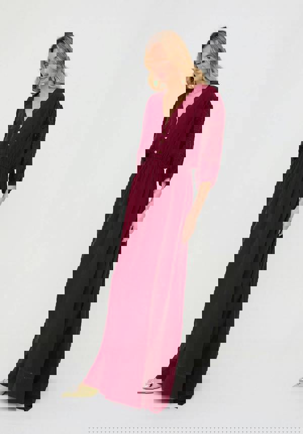 Woman wearing a burgundy dress on a white background