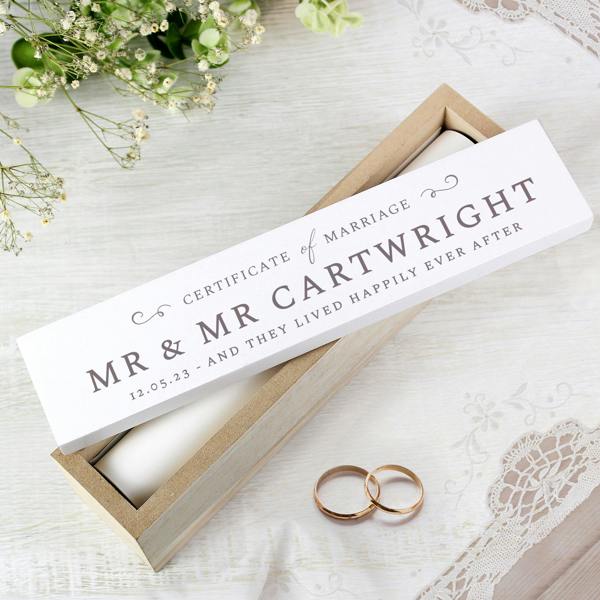 A custom engraved wooden marriage certificate holder displaying a "Mr & Mr" personalisation example with a wedding date.