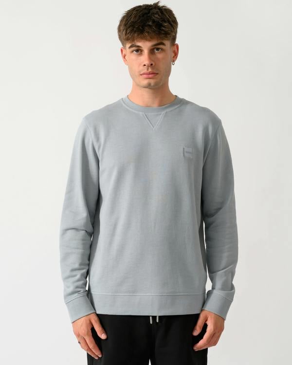 model wearing a BOSS Orange Westart Mens Crew Neck Sweatshirt With Logo Patch in Open Grey 084
