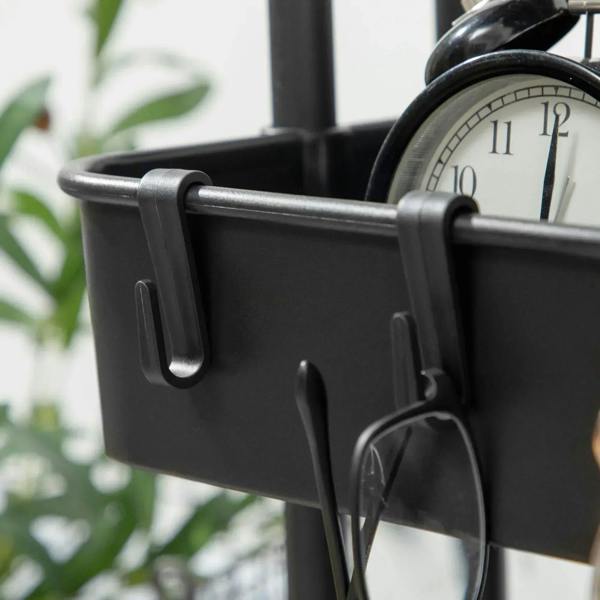 Black hanging basket section with attached side handles on a three-tier storage trolley