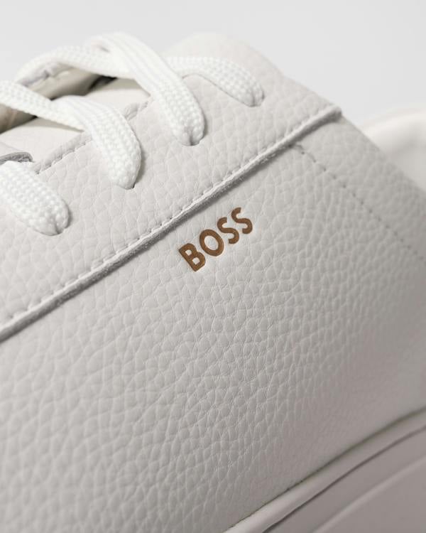 close up studio shot of BOSS Orange Kieran Mens Grained-leather trainers with rubber sole in White 100