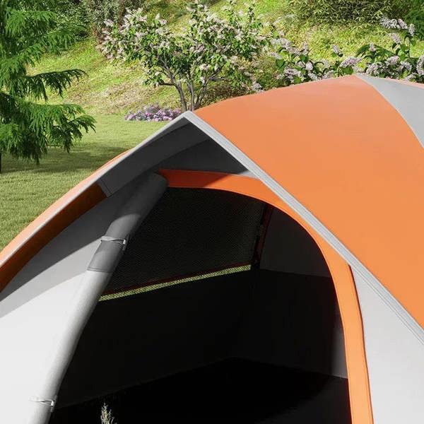 Orange-trim dome tent interior with dark floor and mesh side window