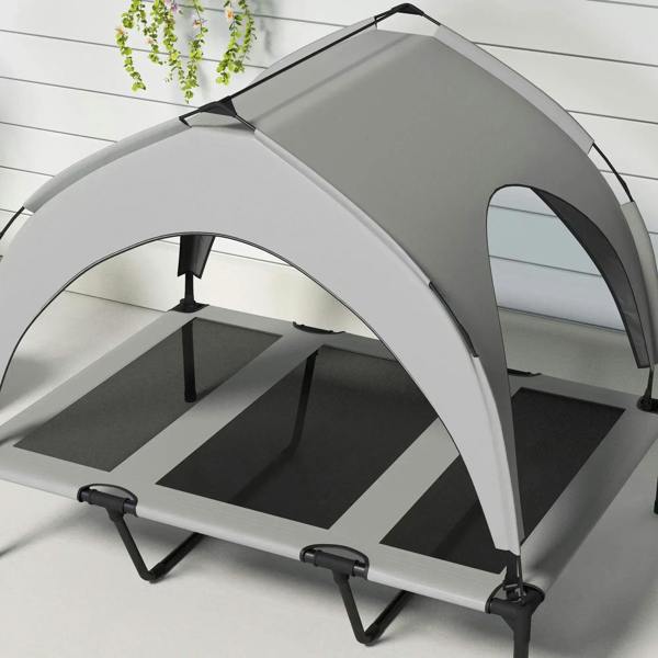 Light grey raised pet bed with arched canopy and black support legs, open mesh base