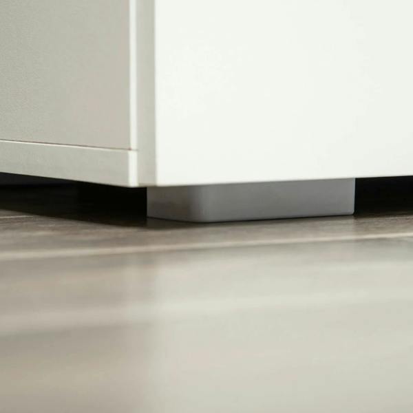 White cabinet base with protective feet pads and clean bottom panel.