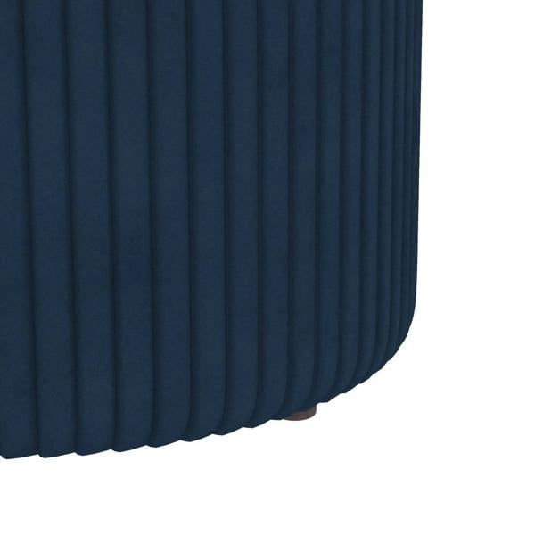 Dark blue velvet-feel storage ottoman with fluted side texture and gold accent band