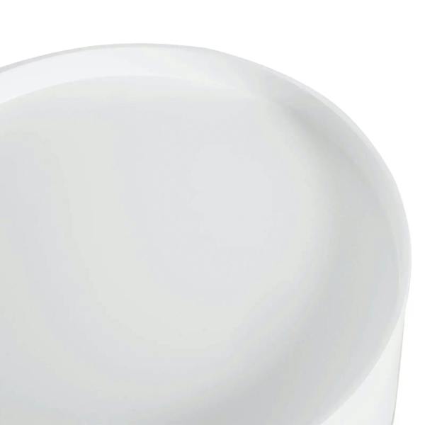 White round tabletop surface of a bedside table