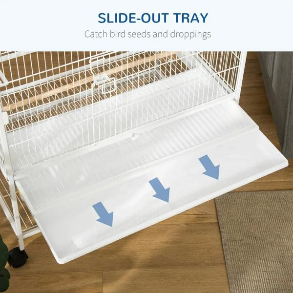 White slide-out tray at bottom of bird cage for easy cleanup