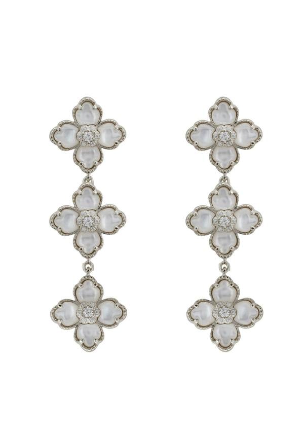 Floral earrings with white stones on a white background