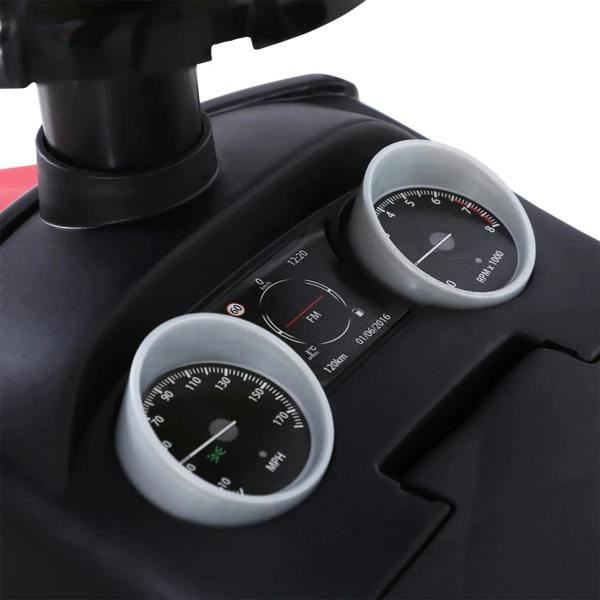 Close-up dashboard with two round gauge dials on a black toddler ride-on car