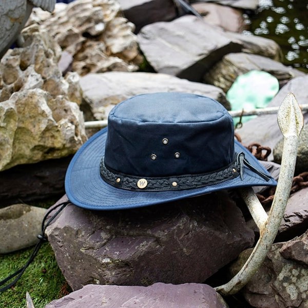 The wilderness navy waxed cotton unisex hat by Wombat