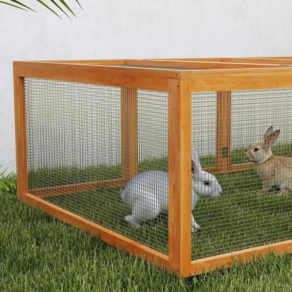 Close-up natural wood rabbit hutch corner with wire mesh walls and rabbits