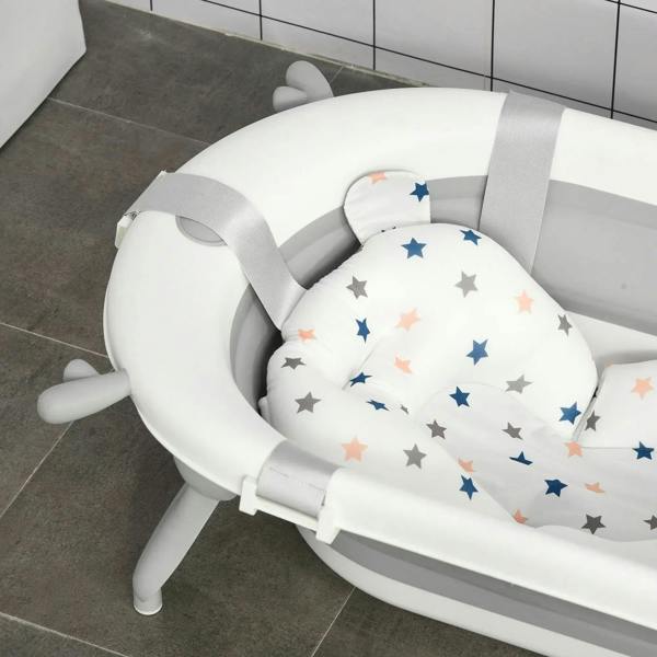 Off-white and gray foldable baby bathtub with star cushioned insert and side support legs