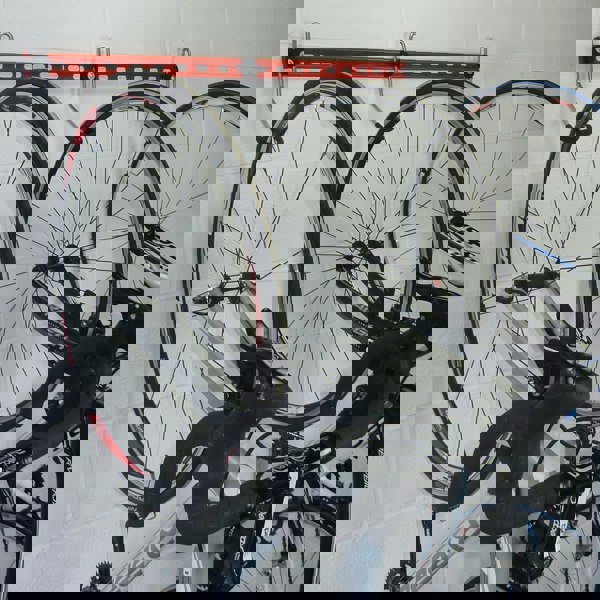 Bike wall rack for 3, 4 or 5 bikes. GearHooks® 3 bike vertical bike storage rack shown with with 3 road bikes