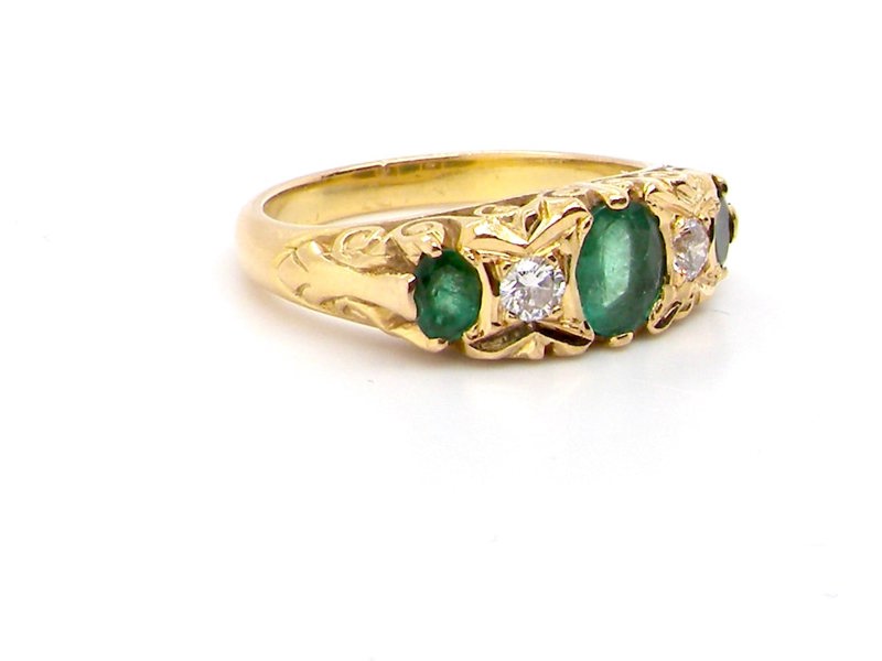 Vintage five stone emerald and diamond ring