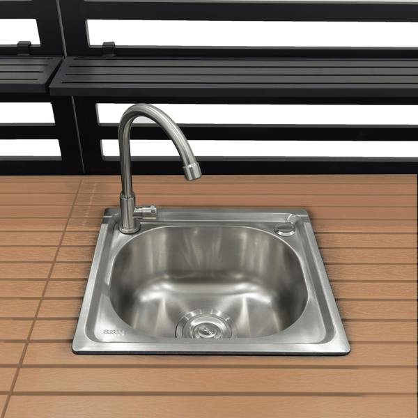 Stainless steel sink with a sleek faucet, set in a wooden countertop, ideal for outdoor kitchen use with a modern design