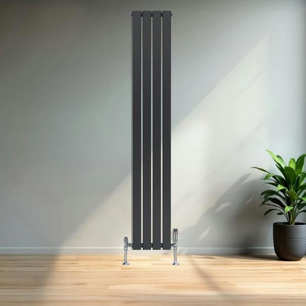 Flat single column radiator in anthracite grey, 1800 x 280mm, featuring a sleek design and modern finish, mounted on a wall with a plant nearby