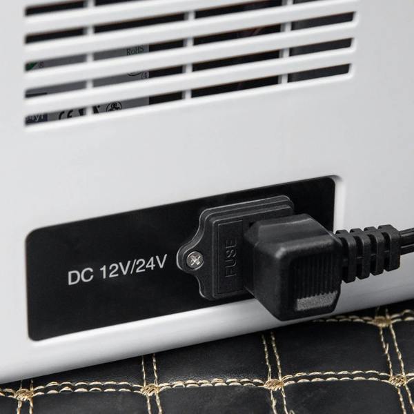 Portable cooler rear power port labeled DC 12V/24V with connected plug