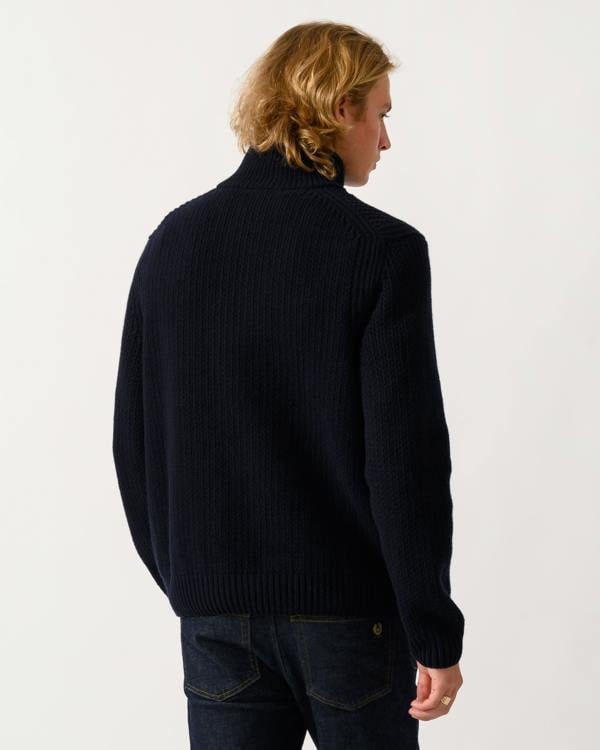back of a model wearing a BOSS Orange Kenter Mens 1/4 Zip Funnel Neck Jumper in Dark Blue 404