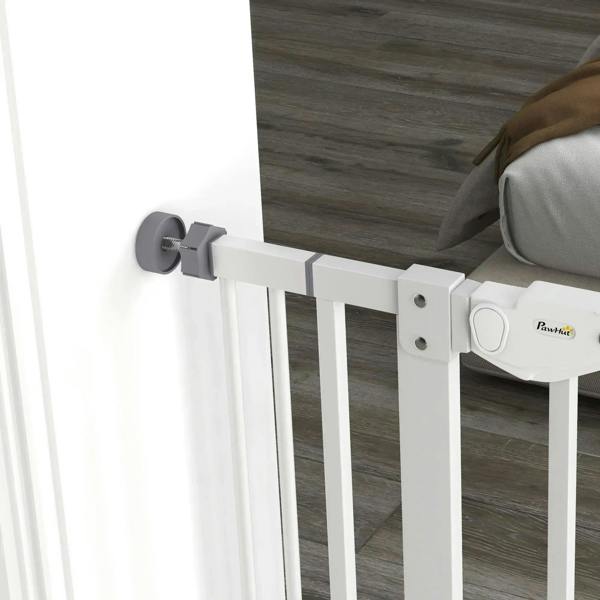 White pet gate close-up of side latch and locking pin for secure closure