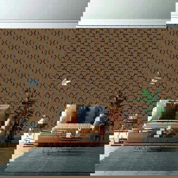 Modern living room with a beige sofa, hexagonal patterned wall, and decorative items.