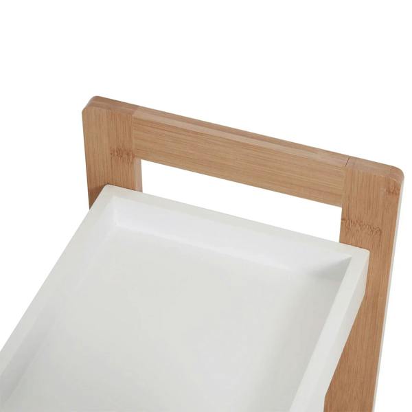 Top tier of bamboo bathroom shelf rack with white shelf surface and rail