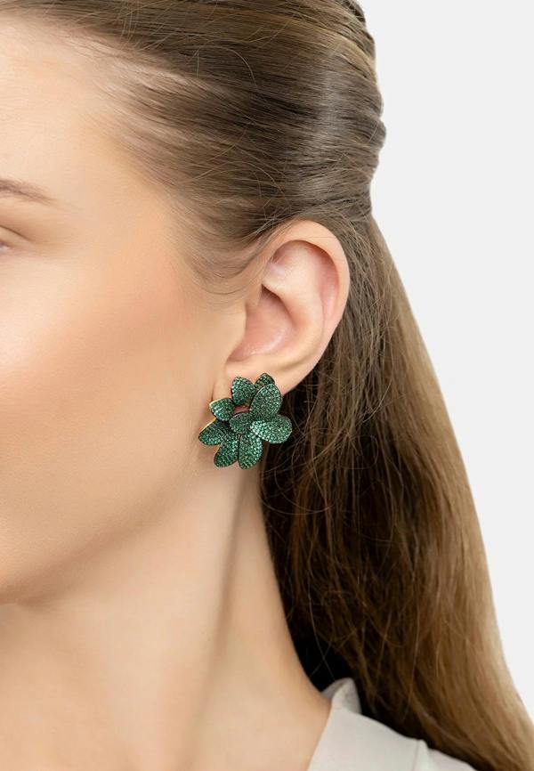 The earring worn by a model.