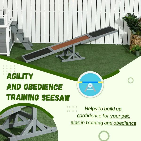 Grey dog seesaw agility training ramp with textured boards and stable X-frame base.