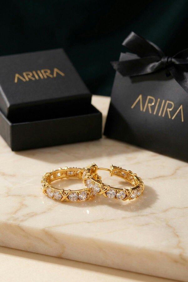 ARIIRA Lorelei Gold Tone Crystal Criss Cross Hoop Earrings