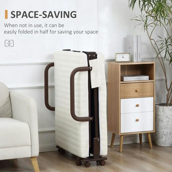 Compact folding bed with white mattress folded upright beside sofa, on wheels