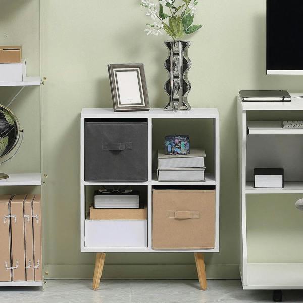 White 4-cube storage cabinet with black and tan fabric drawers, shown with items on top