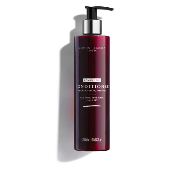 A pump bottle of Advanced+ Conditioner by Daimon Barber. The bottle is dark red with white and silver text detailing the product name and brand.