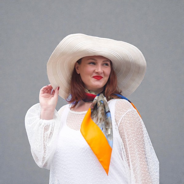 Women's Plus Size Aphrodite White Holiday Resort Dress with a white undergarment, paired with a white sunhat, the Cherry Blossom Silk Scarf and blue heels for a chic holiday look.