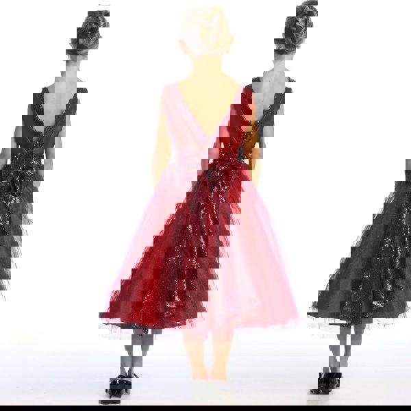 Young girl wearing a burgundy sequin dress
