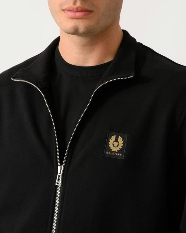 close up shot of a model wearing a Belstaff Mens Logo Full Zip Sweatshirt in Black