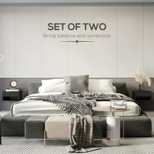 High-gloss black floating bedside tables mounted on wall next to bed