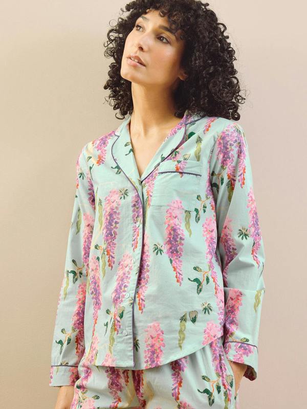 model wears wisteria print short pyjama set. 