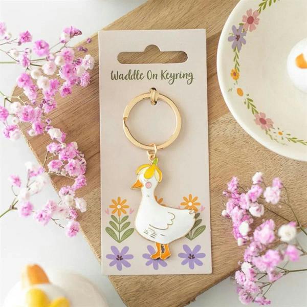 Duck keyring with gold-tone ring and white enamel duck charm, on gift card