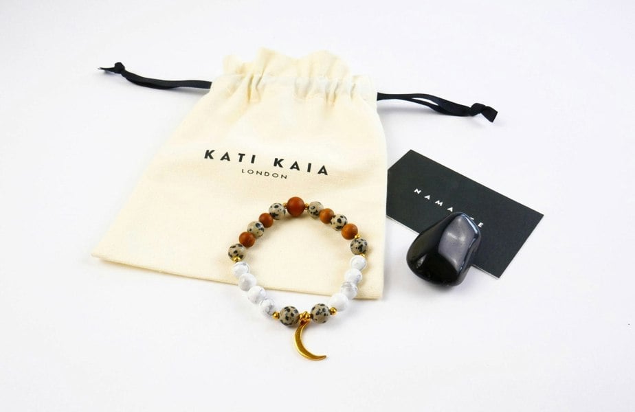 Kati Kaia Luna Sandalwood and Howlite Mala Bracelet in white and brown with a drawstring pouch