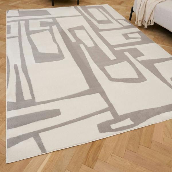 Geometric patterned rug on a wooden floor