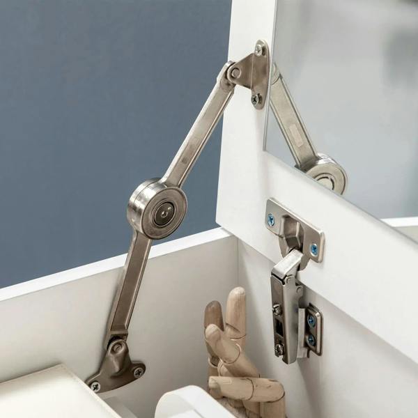 Metal hinge hardware on white flip-up vanity mirror top, showing lift arms