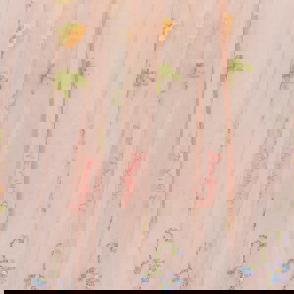 Sheer fabric with floral embroidery on a light pink background