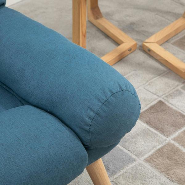 Blue upholstered recliner armrest with stitched cushions and wooden leg